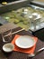 Table setting on bamboo towel for oriental lunch near a fountain