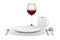 Table setting with glass of red wine isolated