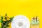 Table setting with plates and flatware on yellow background top view mockup