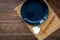 Table setting for sushi roll. Empty plate on mat near chopstick and bowl for sause on wooden table top view copyspace