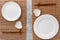 Table setting for sushi roll. Empty plate on mat near chopstick on grey table top view mockup