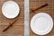 Table setting for sushi roll. Empty plate on mat near chopstick on grey table top view mockup