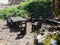 A table and several chairs made of solid wood in forest