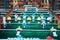 Table soccer. Blue and yellow team players in table football or a kicker football game