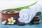 Table with spa objects and tropical flower, stones for massage