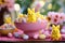 Table with sweets for Good Friday. Chocolate colorful eggs and marshmallow bunnies Easter peeps