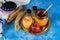 On the table in the synagogue are the symbols of Rosh Hashanah apple and pomegranate, shofar talith