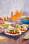 Table with tacos, mango salsa, nachos with sauce, guacamole, lemon beer for Cinco de Mayo celebration party. Appetizers and