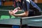 Table tennis player serving