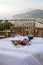 Table on the terrace prepared for a romantic dinner overlooking the Gulf of Naples and Mount Vesuvius.