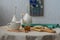 Table on the terrace with soft drinks, flowers and a plate of daisies