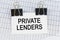 On the table there are reports and a business card with the inscription - PRIVATE LENDERS