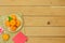 Table top view Lunar New Year & Chinese New Year vacation concept background.Flat lay orange in wood basket & pink cherry blossom