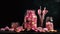 a table topped with jars filled with pink and white candy