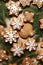 A table topped with lots of cookies covered in icing.