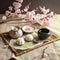 A table topped with a tray of food and a vase filled with flowers. AI generative image . Japanese tea ceremony