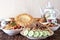 Table with traditional oriental dishes - lagman, shurpa, pilaf and tortillas