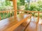 A table and two benches made of large solid wood in log cabin