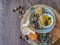 Table view consisting of several bowls with different types of olives, plate with cornbread, cheese and extra virgin olive oil,