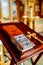 a table on which liturgical books are placed during the service. Lectern.