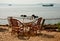 Table with wicker chairs on seacoast