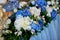 The table of young.Composition of hydrangeas, white tablecloth. White-blue gamma