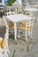 Tables and chairs in a coffee shop in the street