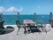 Tables and chairs for dining in the seaside and sky atmosphere.