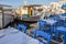 Tables and chairs in fish restaurant. Naoussa port on Paros Island. Cyclades, Greece