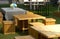 Tables and chairs made by crate on grass garden with sunlight da