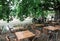 Tables with chairs in a restaurant along a canal of strasbourg