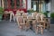 Tables and chairs in street cafe in Europe at morning after party