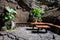 Tables and chairs in volcanic cave, Spain