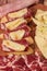 Tables of cold cuts - hams, bondiola -, cheeses and bruschetta tapas, Iberian ham and mozzarella