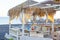 Tables near the Perissa beach in cafe, Santorini island