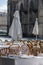 Tables outdoor cafes with wine glasses on the square of the French city