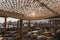 Tables and rows of sun beds and parasols on Platis Gialos, Mykonos, Greece