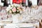 Tables set for an event party or wedding reception. luxury elegant table setting dinner in a restaurant. glasses and