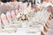 Tables set for an event party or wedding reception. luxury elegant table setting dinner in a restaurant. glasses and