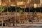 Tables and wicker chairs with straw sunshades in the restaurant