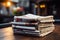 Tableside companionship a stack of newspapers at a cozy cafe