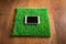 Tablet on artificial grass tile