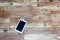 Tablet charging on a wooden floor