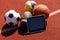 Tablet computer and balls. Concept of sports bet