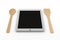 Tablet computer with wooden spoon and fork
