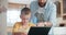 Tablet, education and a father helping his son with online homework or to study while teaching in the kitchen. Tutor
