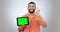 Tablet, green screen and man okay, yes and success hands for social media app or advertising in studio. Face of person