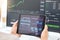 Tablet in hands, graphs and stock market with fintech and trading, investment and financial stats on dashboard. Finance