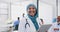 Tablet, healthcare and happy muslim woman doctor in hospital for telehealth, medical research or management in Indonesia