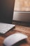 Tablet, mouse and keyboard on the wooden desk